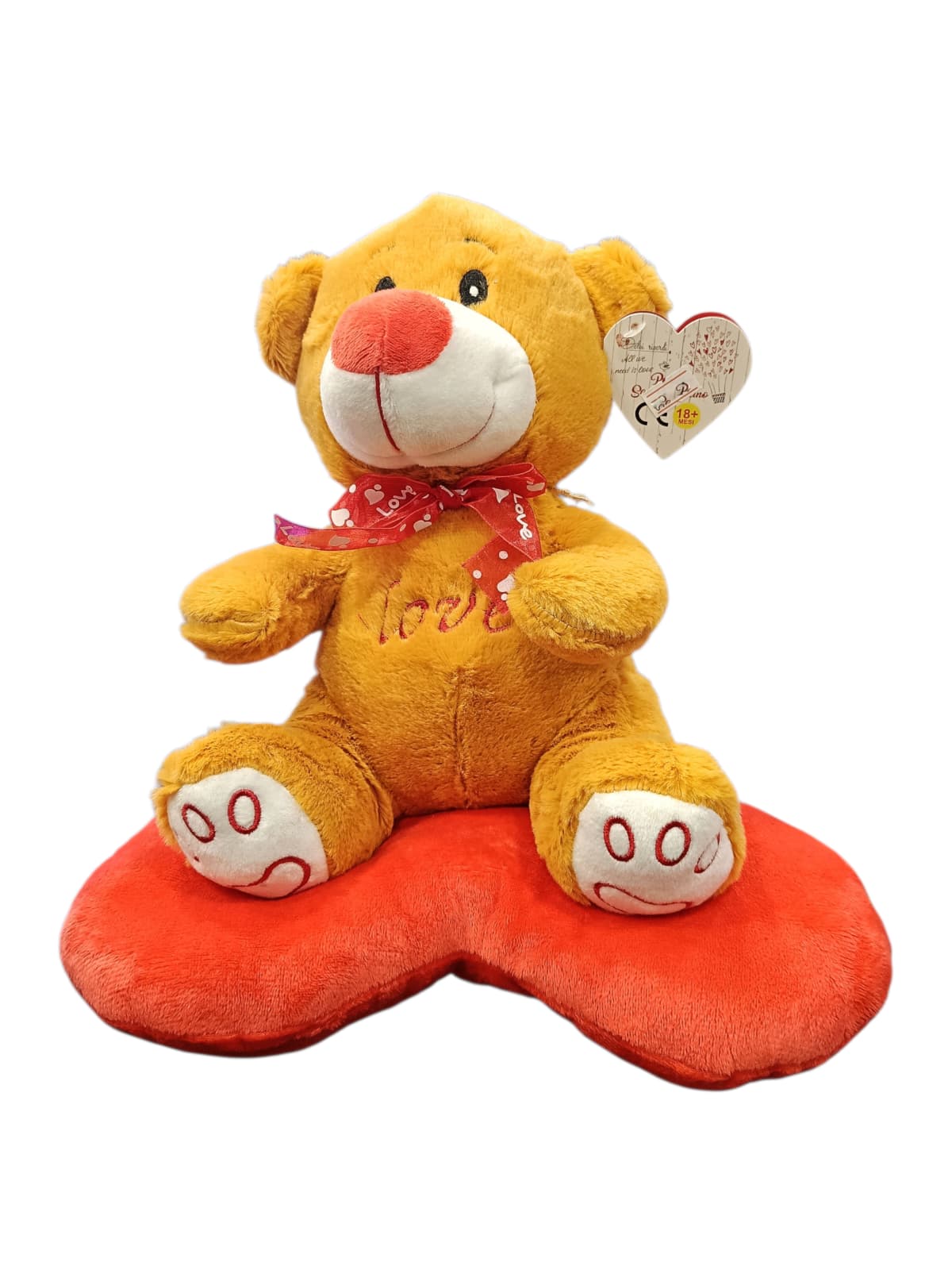 Peluche orsetto appoggiato su cuore Peluche orsetto appoggiato su cuore